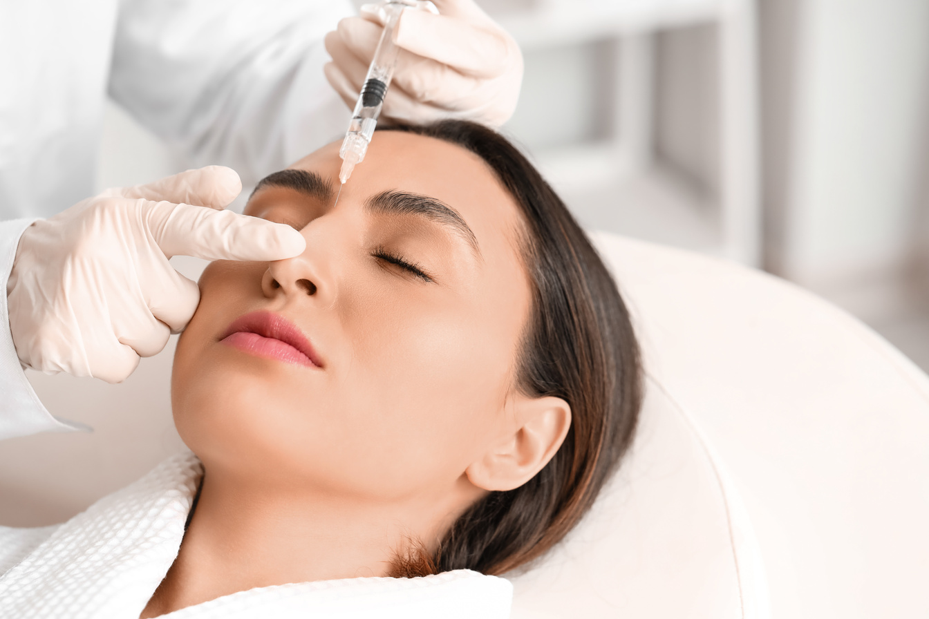 Young Woman Receiving Filler Injection in Beauty  Salon