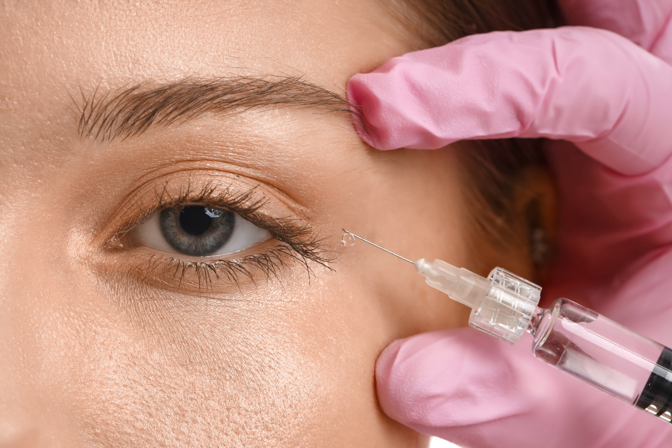 Young Woman Receiving Filler Injection in Face, Closeup